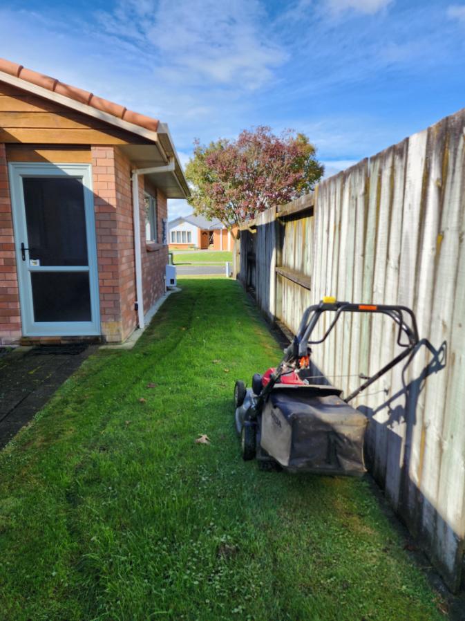 Lawns R Us mowing a residential property in Timaru