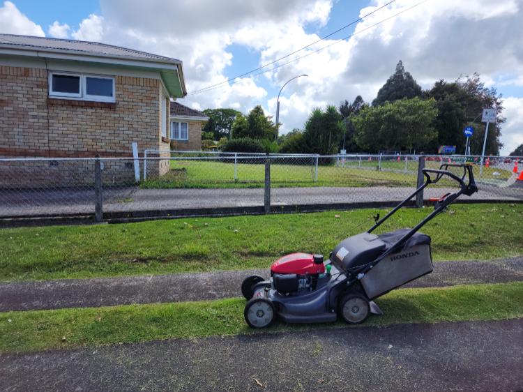 Lawns R Us mowing a residential nature strip in Timaru